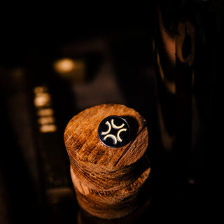Burnt Faith Pin Badge on wood